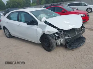 2014 Toyota Corolla L z VIN 5YFBURHE1EP099670, wystawiony jako IAAI lot #42740227 z przebiegiem 101 970 mil mil oraz . Historia ofert i sprzedaży dostępna na DreamBid. Obrazek 1.