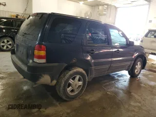 2004 Ford Escape XLS with VIN 1FMYU92154KA14600, listed as a Copart auction lot 83101474 with 305,444 mi miles and Salvage Title. Bid and sale history available at DreamBid. Image 3.