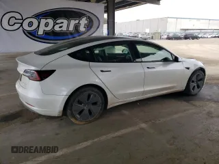 2022 Tesla Model 3 Long Range with VIN 5YJ3E1EB2NF267485, listed as a Copart auction lot 54952505 with 30,569 mi miles and Clean Title. Bid and sale history available at DreamBid. Image 3.