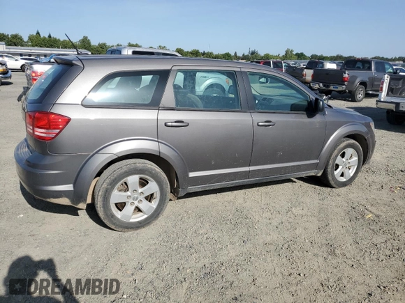 2013 Dodge Journey American Value with VIN 3C4PDCAB8DT590509, listed as a Copart auction lot 57347375 with 203,642 mi miles and Clean title. Bid and sale history available at DreamBid. Image 3.