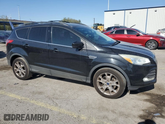 2013 Ford Escape SE with VIN 1FMCU0GX8DUA38056, listed as a Copart auction lot 57617885 with 128,467 mi miles and Salvage title. Bid and sale history available at DreamBid. Image 4.
