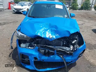 2021 BMW X1 xDrive28i with VIN WBXJG9C04M5T61811, listed as a IAAI auction lot 42509852 with 30,400 mi miles and . Bid and sale history available at DreamBid. Image 6.