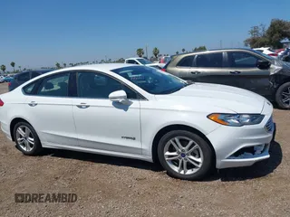 2018 Ford Fusion SE z VIN 3FA6P0LU2JR261268, wystawiony jako IAAI lot #42301578 z przebiegiem 63 357 mil mil oraz . Historia ofert i sprzedaży dostępna na DreamBid. Obrazek 13.
