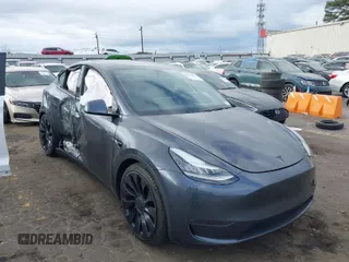 2020 Tesla Model Y Long Range with VIN 5YJYGDEFXLF001469, listed as a IAAI auction lot 41715853 with 34,483 mi miles and . Bid and sale history available at DreamBid. Image 1.