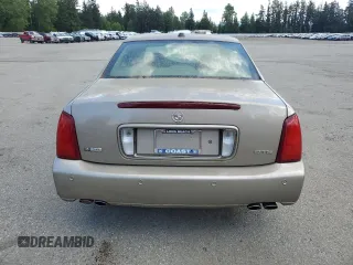 2004 Cadillac DeVille DTS z VIN 1G6KF579X4U212415, wystawiony jako Copart lot #58005555 z przebiegiem 97 663 mil mil oraz Tytuł czysty. Historia ofert i sprzedaży dostępna na DreamBid. Obrazek 6.