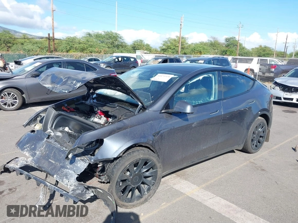 2023 Tesla Model Y Long Range z VIN 7SAYGAEE4PF945847, wystawiony jako IAAI lot #41071924 z przebiegiem 33 454 mil mil oraz . Historia ofert i sprzedaży dostępna na DreamBid. Obrazek 6.