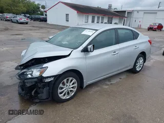 2019 Nissan Sentra S z VIN 3N1AB7AP7KY425276, wystawiony jako IAAI lot #41745256 z przebiegiem 72 306 mil mil oraz . Historia ofert i sprzedaży dostępna na DreamBid. Obrazek 2.