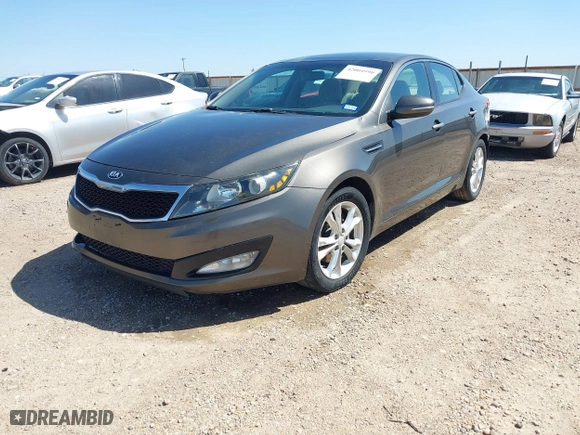 2013 Kia Optima LX with VIN 5XXGM4A74DG093454, listed as a IAAI auction lot 42004990 with 176,667 mi miles. Bid and sale history available at carsss.com. Image 2.
