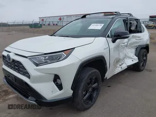2021 Toyota RAV4 Hybrid XSE with VIN 2T3E6RFV4MW021009, listed as a IAAI auction lot 41940278 with 33,016 mi miles and . Bid and sale history available at DreamBid. Image 2.