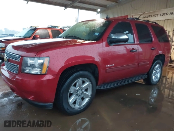 2013 Chevrolet Tahoe LS with VIN 1GNSCAE09DR171918, listed as a IAAI auction lot 41573324 with 175,935 mi miles and . Bid and sale history available at DreamBid. Image 2.