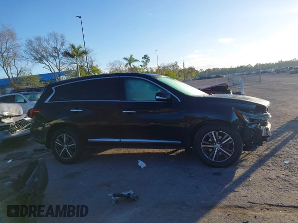 2019 Infiniti QX60 LUXE with VIN 5N1DL0MN0KC548592, listed as a IAAI auction lot 41305876 with 142,064 mi miles. Bid and sale history available at carsss.com. Image 13.
