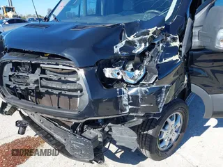 2016 Ford Transit Cargo z VIN 1FTYR2CM6GKB54374, wystawiony jako IAAI lot #41674672 z przebiegiem 128 594 mil mil oraz . Historia ofert i sprzedaży dostępna na DreamBid. Obrazek 6.