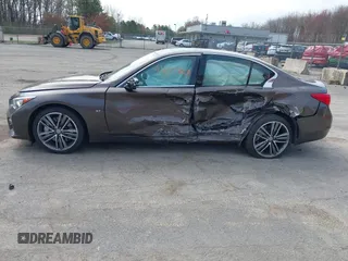 2014 Infiniti Q50 Premium z VIN JN1BV7AR0EM687810, wystawiony jako IAAI lot #42073610 z przebiegiem 167 912 mil mil oraz . Historia ofert i sprzedaży dostępna na DreamBid. Obrazek 14.