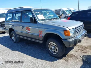 1993 Mitsubishi Montero z VIN JA4MR41H4PJ007602, wystawiony jako IAAI lot #41832401 z przebiegiem 191 549 mil mil oraz . Historia ofert i sprzedaży dostępna na DreamBid. Obrazek 1.