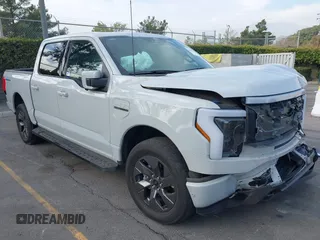 2023 Ford F-150 Lightning Pro with VIN 1FTVW1EV6PWG10099, listed as a IAAI auction lot 40983988 with 16,072 mi miles. Bid and sale history available at carsss.com. Image 1.