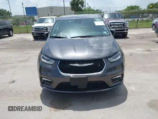 2023 Chrysler Pacifica Touring L with VIN 2C4RC1BG6PR590302, listed as a IAAI auction lot 42451369 with 72,097 mi miles and . Bid and sale history available at DreamBid. Image 12.