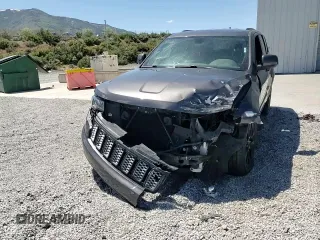 2018 Jeep Grand Cherokee Altitude with VIN 1C4RJFAG5JC320742, listed as a Copart auction lot 56988195 with 140,320 mi miles and Salvage title. Bid and sale history available at DreamBid. Image 14.