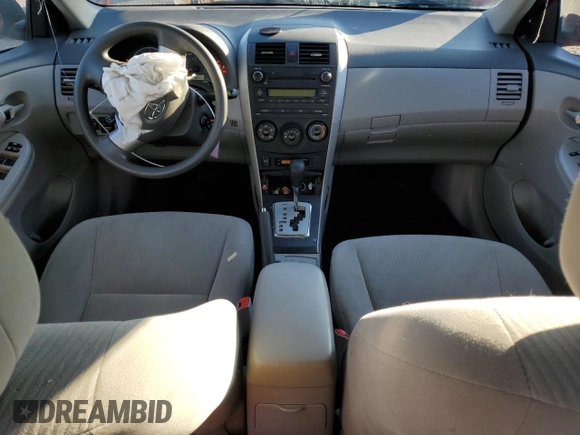 2010 Toyota Corolla z VIN 1NXBU4EE0AZ289475, wystawiony jako Copart lot #43056795 z przebiegiem 183 995 mil mil oraz Szkoda całkowita • Salvage title. Historia ofert i sprzedaży dostępna na DreamBid. Obrazek 8.