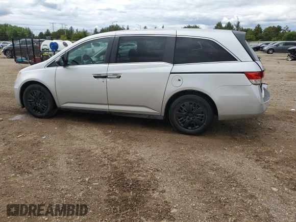 2014 Honda Odyssey LX z VIN 5FNRL5H21EB106600, wystawiony jako Copart lot #57875765 z przebiegiem 122 159 mil mil oraz Szkoda całkowita • Salvage title. Historia ofert i sprzedaży dostępna na DreamBid. Obrazek 2.