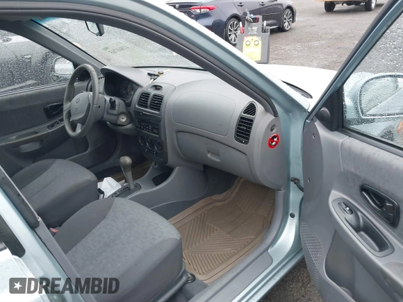 2003 Hyundai Accent GL with VIN KMHCG45C33U473080, listed as a IAAI auction lot 41868765 with 57,478 mi miles. Bid and sale history available at carsss.com. Image 5.
