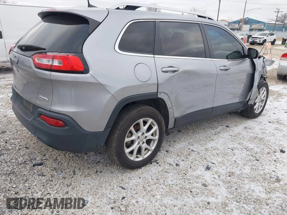 2016 Jeep Cherokee 75th Anniversary with VIN 1C4PJLCB1GW297555, listed as a IAAI auction lot 41232269 with 257,033 mi miles. Bid and sale history available at carsss.com. Image 4.