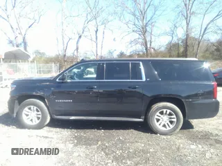 2019 Chevrolet Suburban LT with VIN 1GNSCHKCXKR405939, listed as a IAAI auction lot 41591475 with 106,554 mi miles and . Bid and sale history available at DreamBid. Image 13.