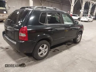 2006 Hyundai Tucson GL with VIN KM8JM12B26U325338, listed as a IAAI auction lot 41809578 with 127,210 mi miles. Bid and sale history available at carsss.com. Image 4.