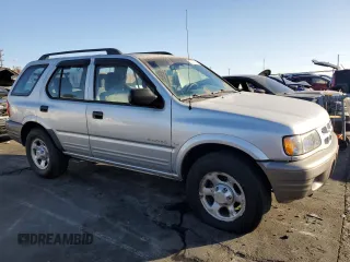 2000 Isuzu Rodeo S z VIN 4S2CK58W2Y4311726, wystawiony jako Copart lot #85070364 z przebiegiem 226 510 mil mil oraz Szkody całkowita. Historia ofert i sprzedaży dostępna na DreamBid. Obrazek 4.