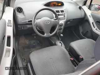 2011 Toyota Yaris with VIN JTDJT4K37B5339113, listed as a Copart auction lot 82474554 with 148,800 mi miles and Salvage Title. Bid and sale history available at carsss.com. Image 8.