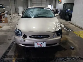 1999 Ford Taurus SE with VIN 1FAFP53S6XA242981, listed as a Copart auction lot 43211425 with 111,966 mi miles and Salvage title. Bid and sale history available at DreamBid. Image 5.