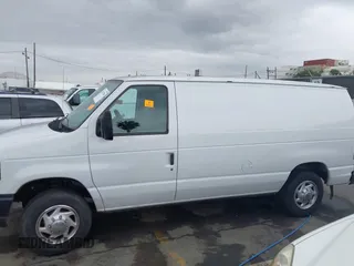 2014 Ford Econoline Cargo Commercial with VIN 1FTNE1EWXEDA18404, listed as a IAAI auction lot 42173934 with 188,301 mi miles and . Bid and sale history available at DreamBid. Image 14.