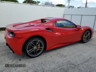 2017 Ferrari 488 z VIN ZFF80AMA6H0221790, wystawiony jako Copart lot #66868284 z przebiegiem Nie podano mil oraz Szkody całkowita. Historia ofert i sprzedaży dostępna na DreamBid. Obrazek 3.