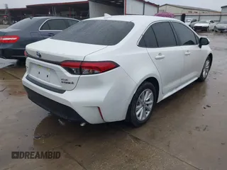 2024 Toyota Corolla Hybrid LE with VIN JTDBCMFE4RJ027221, listed as a IAAI auction lot 41084897 with 10,683 mi miles. Bid and sale history available at carsss.com. Image 4.