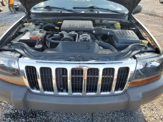 2002 Jeep Grand Cherokee Laredo with VIN 1J4GW48N32C180185, listed as a Copart auction lot 51988335 with 212,399 mi miles and Salvage Title. Bid and sale history available at carsss.com. Image 14.