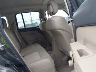 2011 Jeep Patriot Latitude with VIN 1J4NT1GA0BD129377, listed as a IAAI auction lot 42098404 with 212,834 mi miles. Bid and sale history available at carsss.com. Image 8.
