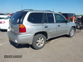 2004 GMC Envoy SLT z VIN 1GKDT13S642449872, wystawiony jako IAAI lot #42236157 z przebiegiem 205 194 mil mil oraz . Historia ofert i sprzedaży dostępna na DreamBid. Obrazek 4.