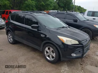 2013 Ford Escape SE with VIN 1FMCU0GX5DUB68604, listed as a IAAI auction lot 42126594 with 165,540 mi miles and . Bid and sale history available at carsss.com. Image 1.