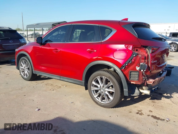 2020 Mazda CX-5 Grand Touring with VIN JM3KFADM7L0729537, listed as a IAAI auction lot 41864569 with 82,998 mi miles. Bid and sale history available at carsss.com. Image 3.