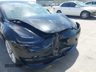2019 Tesla Model 3 Long Range with VIN 5YJ3E1EB6KF192477, listed as a IAAI auction lot 41981600 with 62,888 mi miles. Bid and sale history available at carsss.com. Image 6.