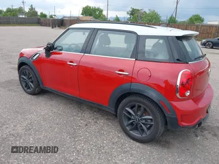 2013 MINI Countryman S with VIN WMWZC3C57DWP21892, listed as a IAAI auction lot 42402600 with 59,700 mi miles and . Bid and sale history available at DreamBid. Image 3.