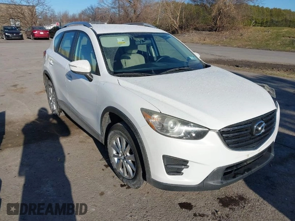 2016 Mazda CX-5 Sport with VIN JM3KE4BY8G0605504, listed as a IAAI auction lot 41866173 with 91,797 mi miles. Bid and sale history available at carsss.com. Image 1.