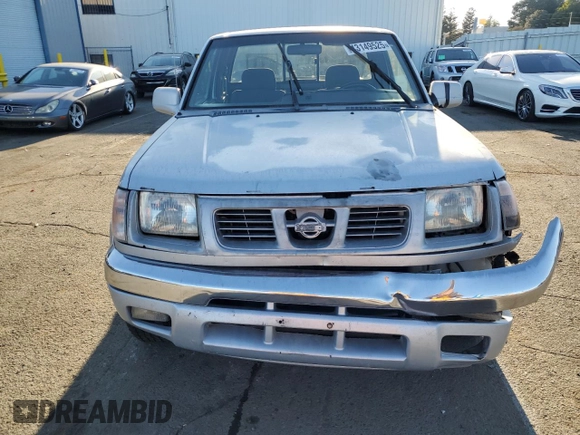 2000 Nissan Frontier XE with VIN 1N6ED26T1YC327635, listed as a Copart auction lot 43149525 with 922,578 mi miles and Salvage title. Bid and sale history available at DreamBid. Image 5.