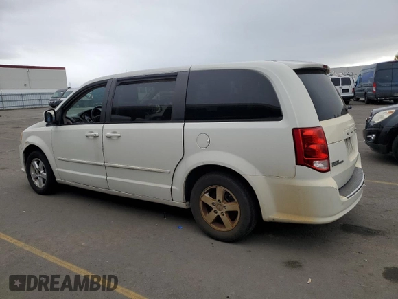 2012 Dodge Grand Caravan SXT with VIN 2C4RDGCG6CR204681, listed as a Copart auction lot 80799044 with 183,195 mi miles and Salvage Title. Bid and sale history available at DreamBid. Image 2.