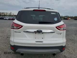 2016 Ford Escape Titanium with VIN 1FMCU9JX6GUB85980, listed as a Copart auction lot 51748715 with 129,537 mi miles and Salvage Title. Bid and sale history available at carsss.com. Image 6.