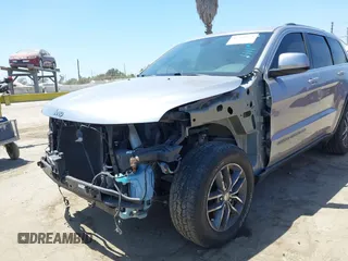 2018 Jeep Grand Cherokee Laredo E with VIN 1C4RJEAG2JC429850, listed as a IAAI auction lot 42541574 with 72,009 mi miles and . Bid and sale history available at DreamBid. Image 6.