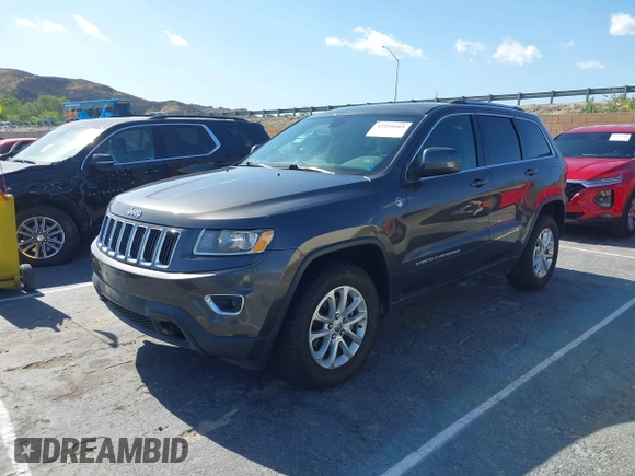 2016 Jeep Grand Cherokee Laredo z VIN 1C4RJFAG5GC390413, wystawiony jako IAAI lot #42254165 z przebiegiem 99 231 mil mil oraz . Historia ofert i sprzedaży dostępna na DreamBid. Obrazek 2.
