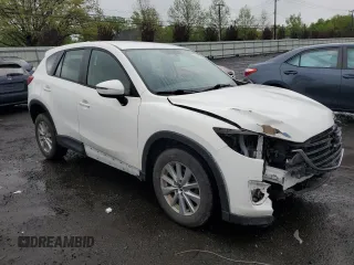 2016 Mazda CX-5 Sport z VIN JM3KE4BY2G0802376, wystawiony jako Copart lot #55976585 z przebiegiem 112 600 mil mil oraz Szkoda całkowita • Salvage title. Historia ofert i sprzedaży dostępna na DreamBid. Obrazek 4.