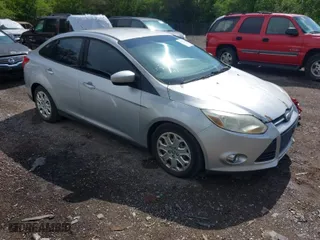 2012 Ford Focus SE with VIN 1FAHP3F22CL115877, listed as a IAAI auction lot 42031223 with 138,743 mi miles. Bid and sale history available at carsss.com. Image 1.