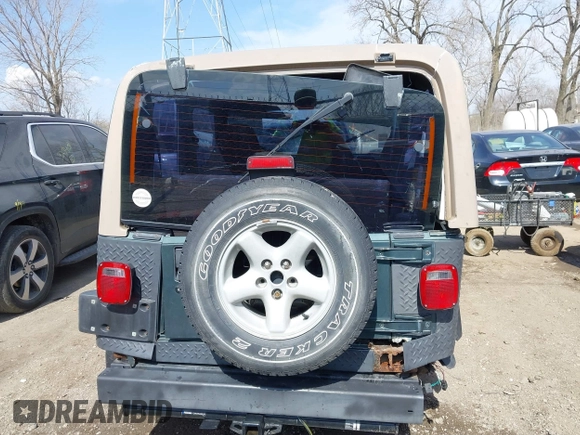 2002 Jeep Wrangler Sport with VIN 1J4FA49S62P743771, listed as a IAAI auction lot 41791205 with 186,622 mi miles. Bid and sale history available at carsss.com. Image 17.