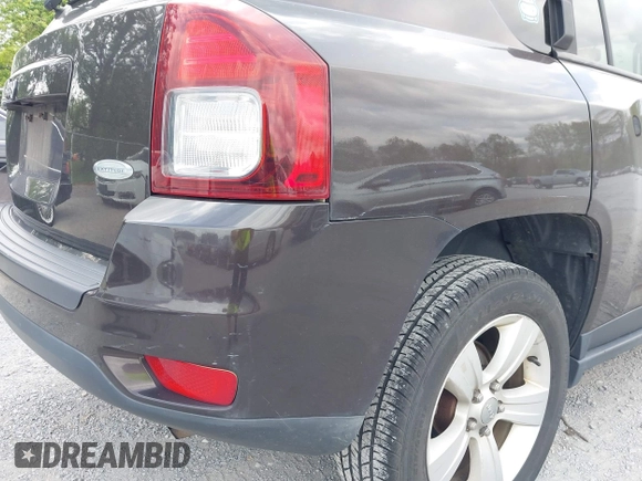 2014 Jeep Compass Latitude with VIN 1C4NJDEBXED622352, listed as a IAAI auction lot 42130403 with 149,024 mi miles. Bid and sale history available at carsss.com. Image 12.
